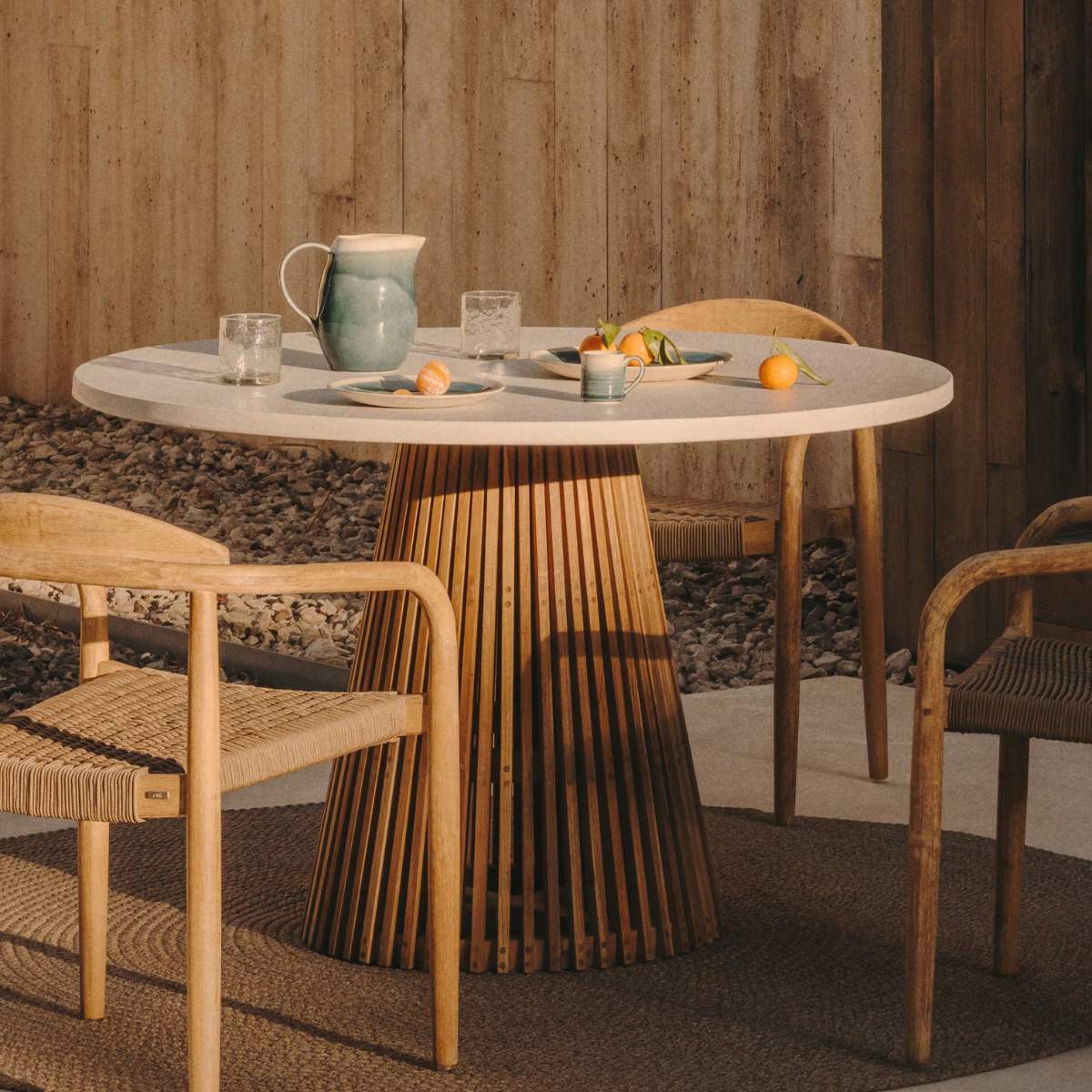Kave Home Alcaufar round outdoor table made of solid teak wood and white cement Ø 90 cm