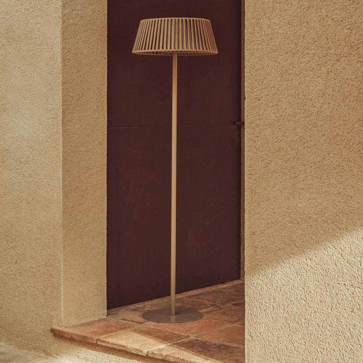 Kave Home Aldet outdoor solar floor lamp in terracotta flat rope cord with metal stand Ø46cm