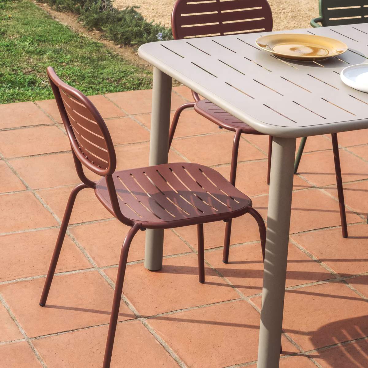 Kave Home Brai stackable outdoor chair in burgundy galvanised steel