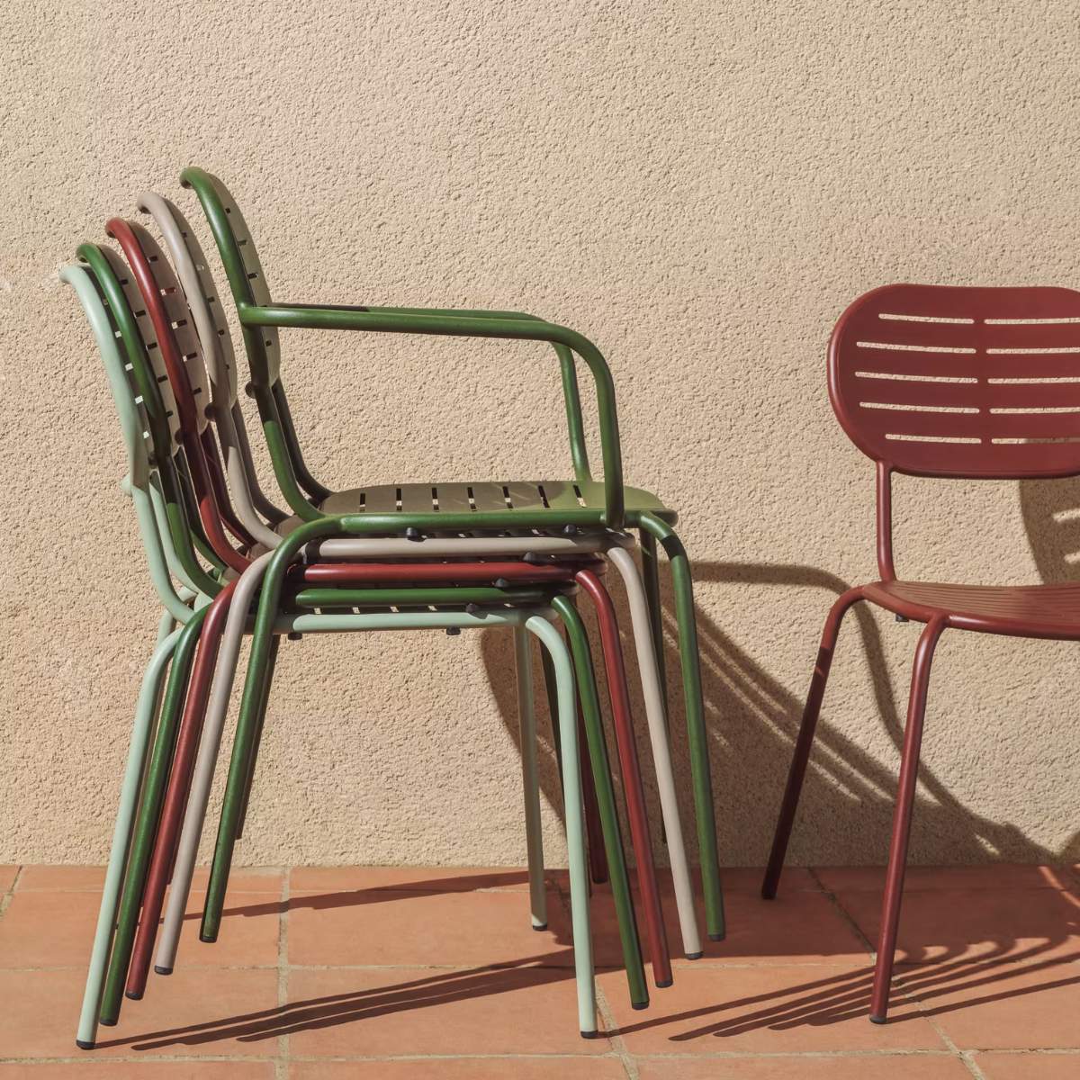 Kave Home Brai stackable outdoor chair with armrests in taupe galvanised steel