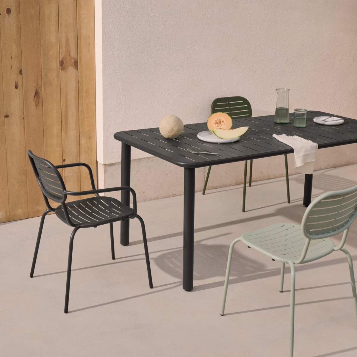 Kave Home Brai stackable outdoor chair with armrests in taupe galvanised steel