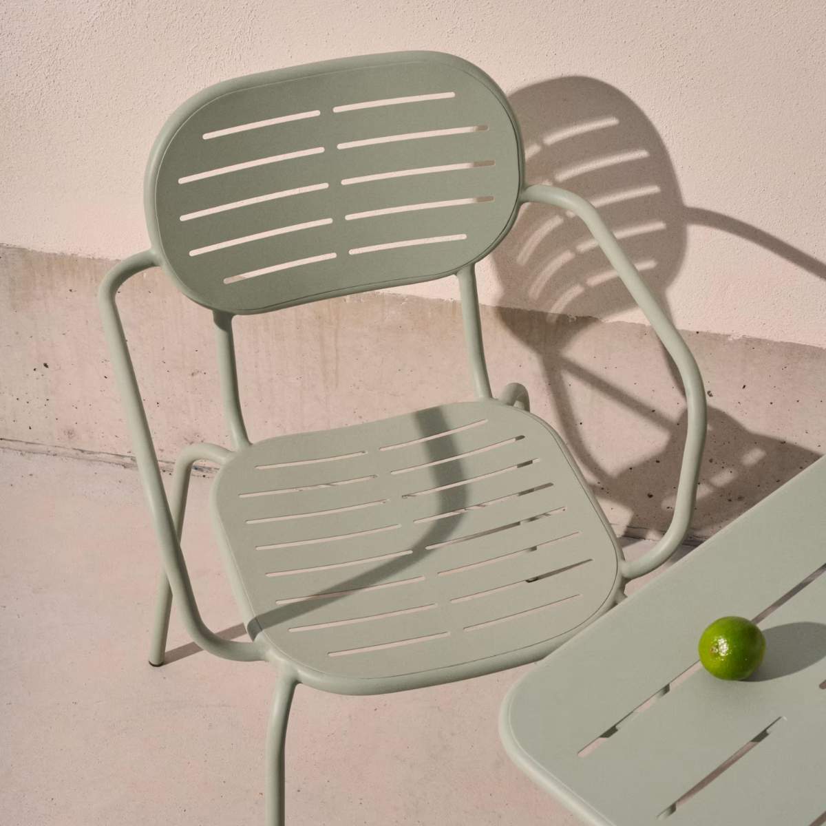 Kave Home Brai stackable outdoor chair with armrests in taupe galvanised steel