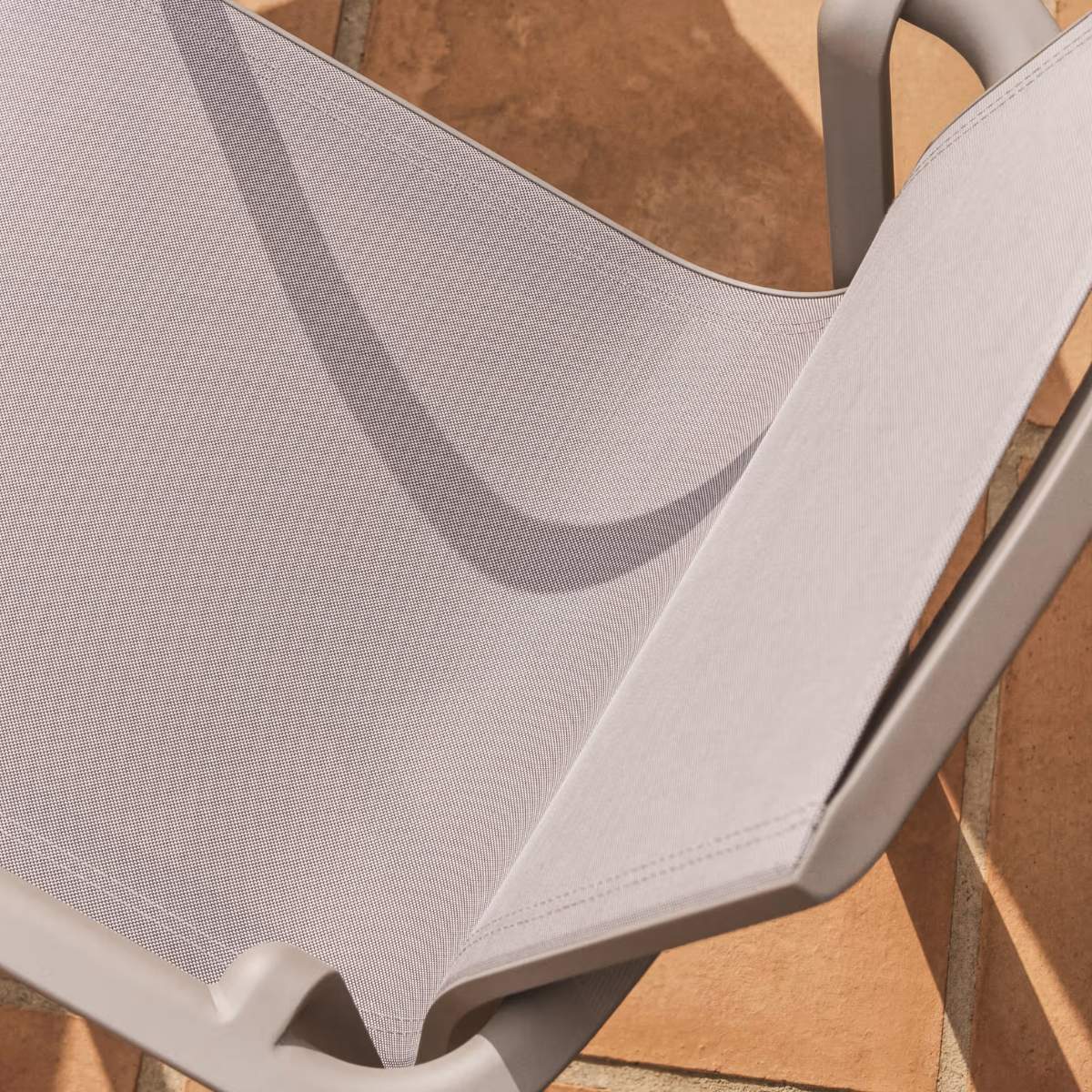 Kave Home Canea stackable outdoor chair in beige texteline and ecru aluminium