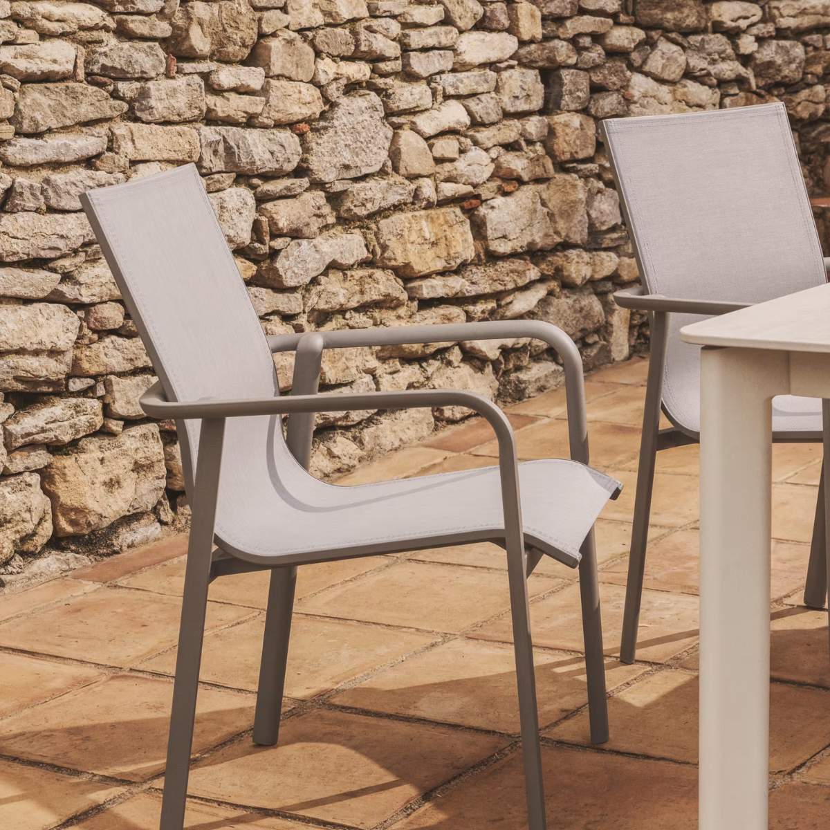 Kave Home Canea stackable outdoor chair in beige texteline and ecru aluminium