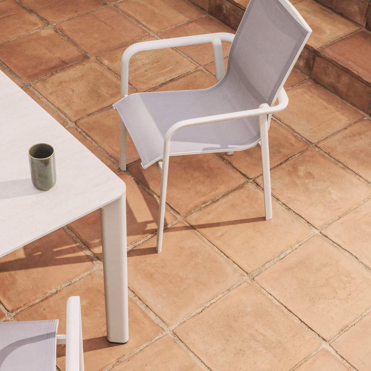 Kave Home Canea stackable outdoor chair in beige texteline and ecru aluminium