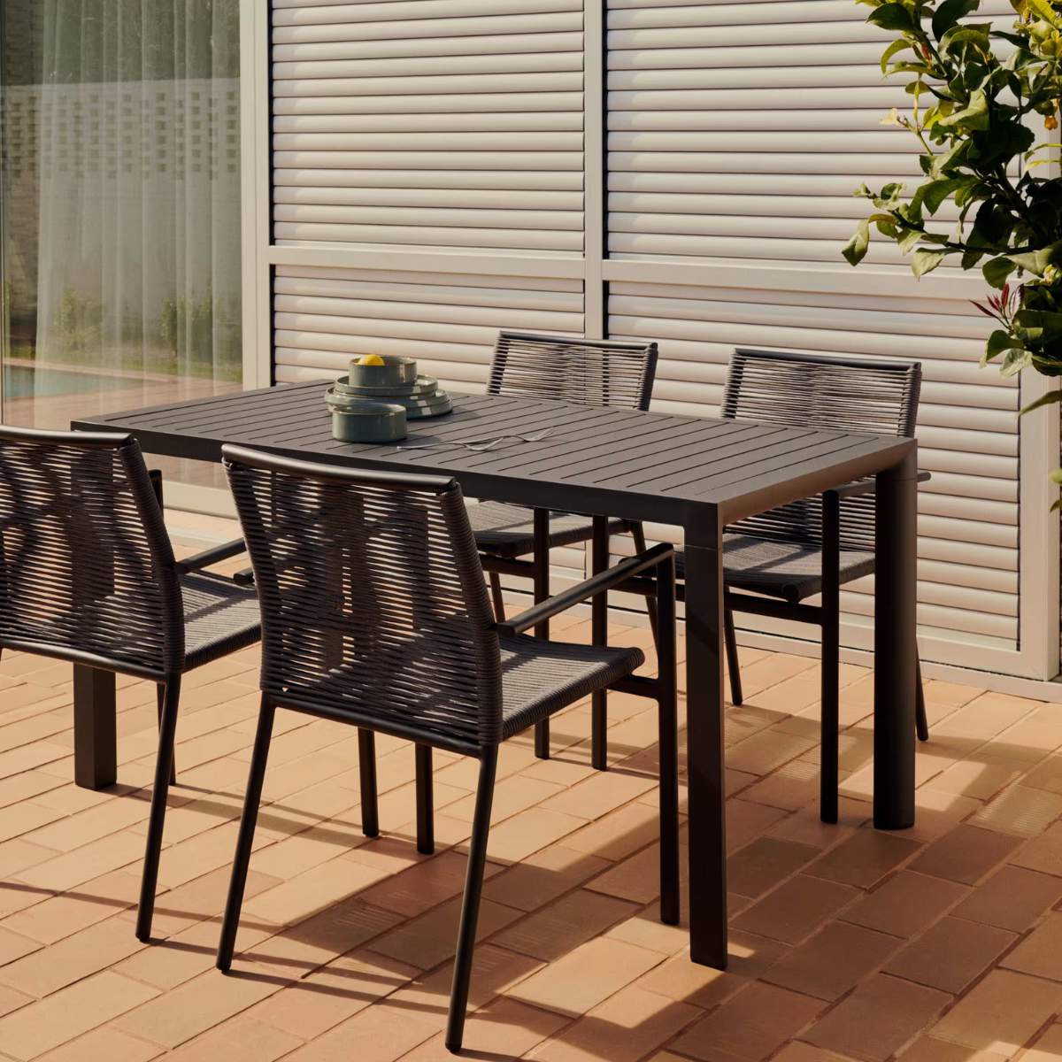 Kave Home Culip stackable outdoor chair in aluminium and cord in brown