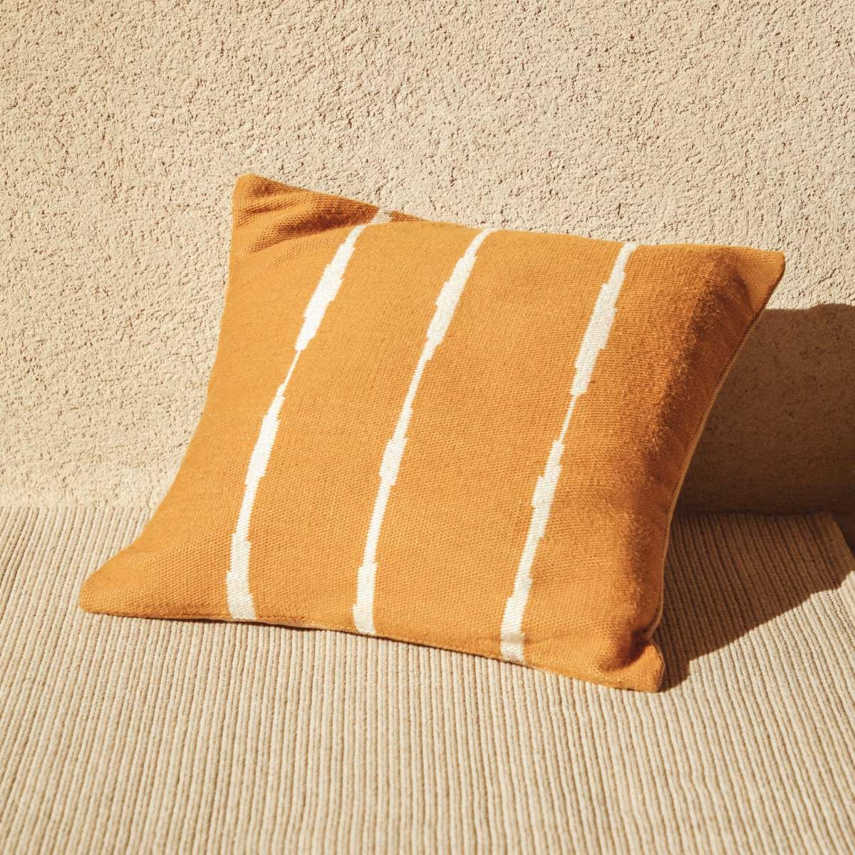 Kave Home Daila orange 100% PET floor cushion cover with Ikat graphic 70 x 70 cm