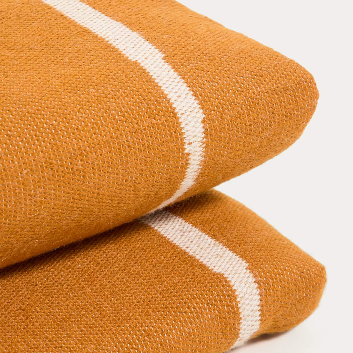 Kave Home Daila orange 100% PET sun lounger cushion with Ikat graphic 50 x 175cm