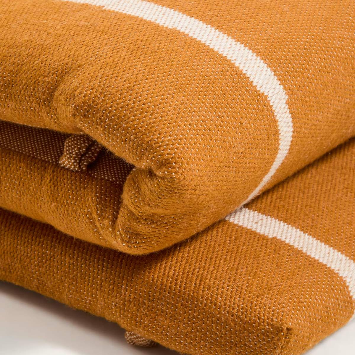 Kave Home Daila orange 100% PET sun lounger cushion with Ikat graphic 50 x 175cm