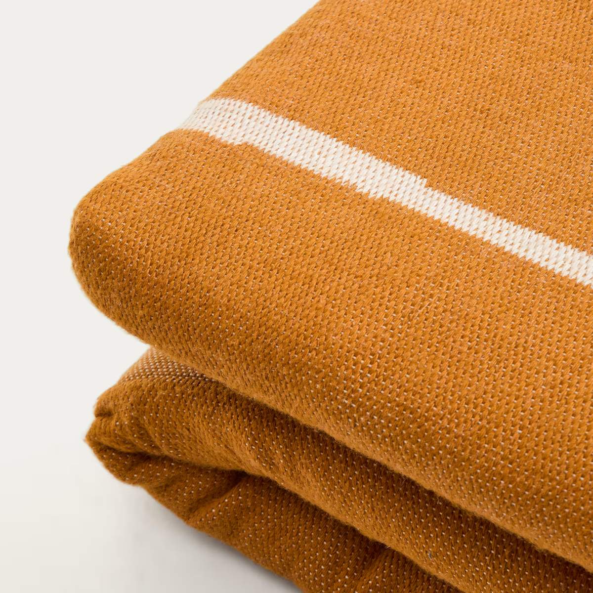 Kave Home Daila orange 100% PET sun lounger cushion with Ikat graphic 50 x 175cm
