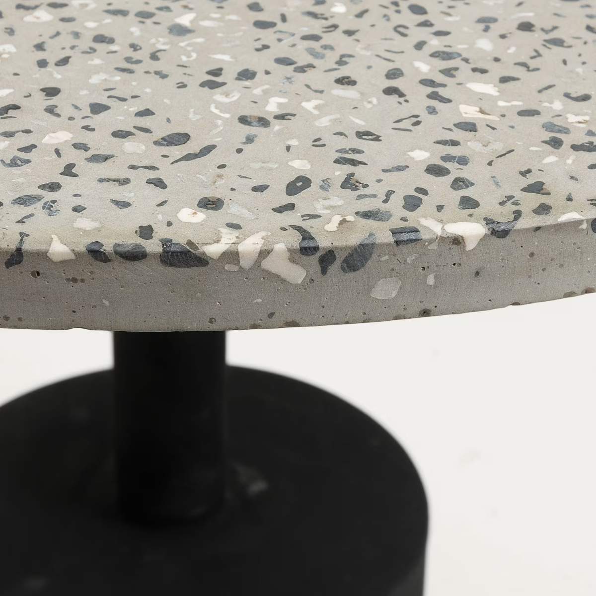 Kave Home Delano grey terrazzo side table with steel legs in a black finish, Ø 55 cm