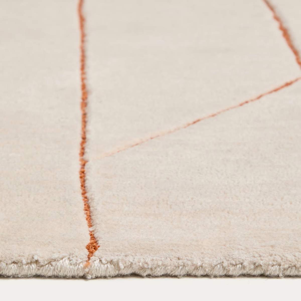 Kave Home Delide ecru synthetic fibre rug with orange graphic detail 160 x 230cm