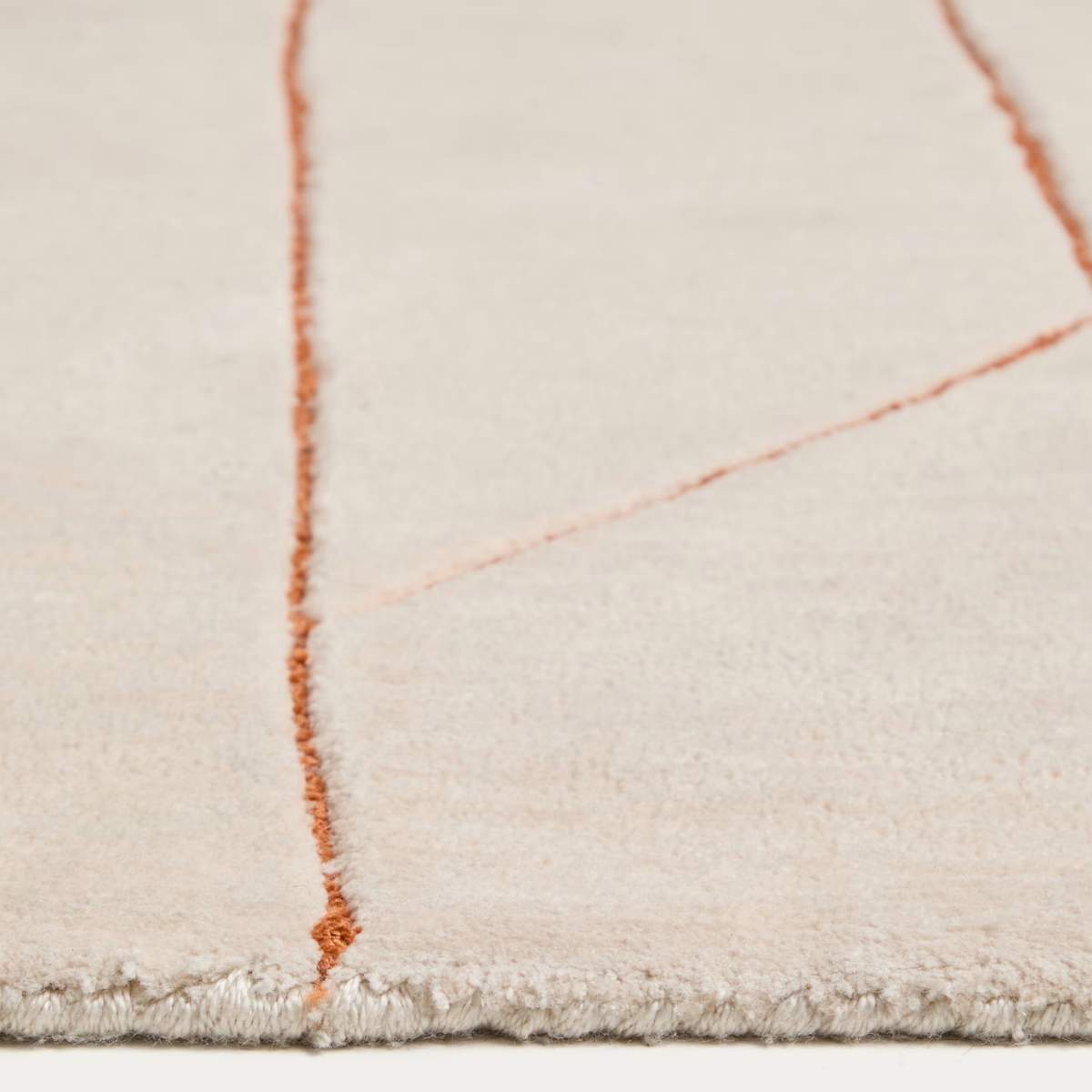 Kave Home Delide ecru synthetic fibre rug with orange graphic detail 200 x 300cm