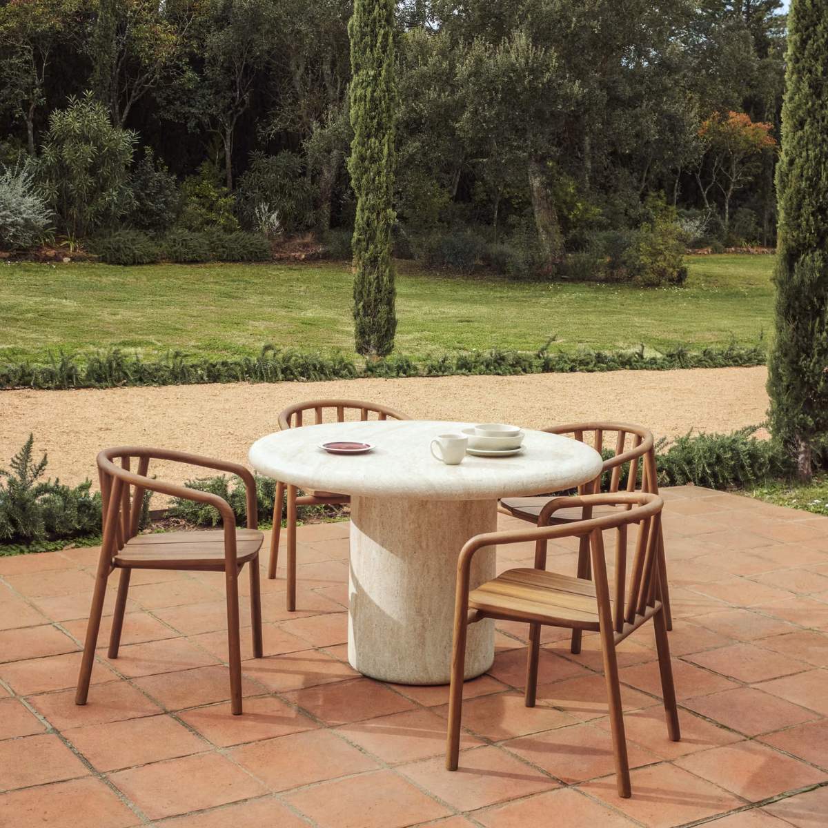 Kave Home Drasi round concrete table with travertine-effect finish Ø122cm