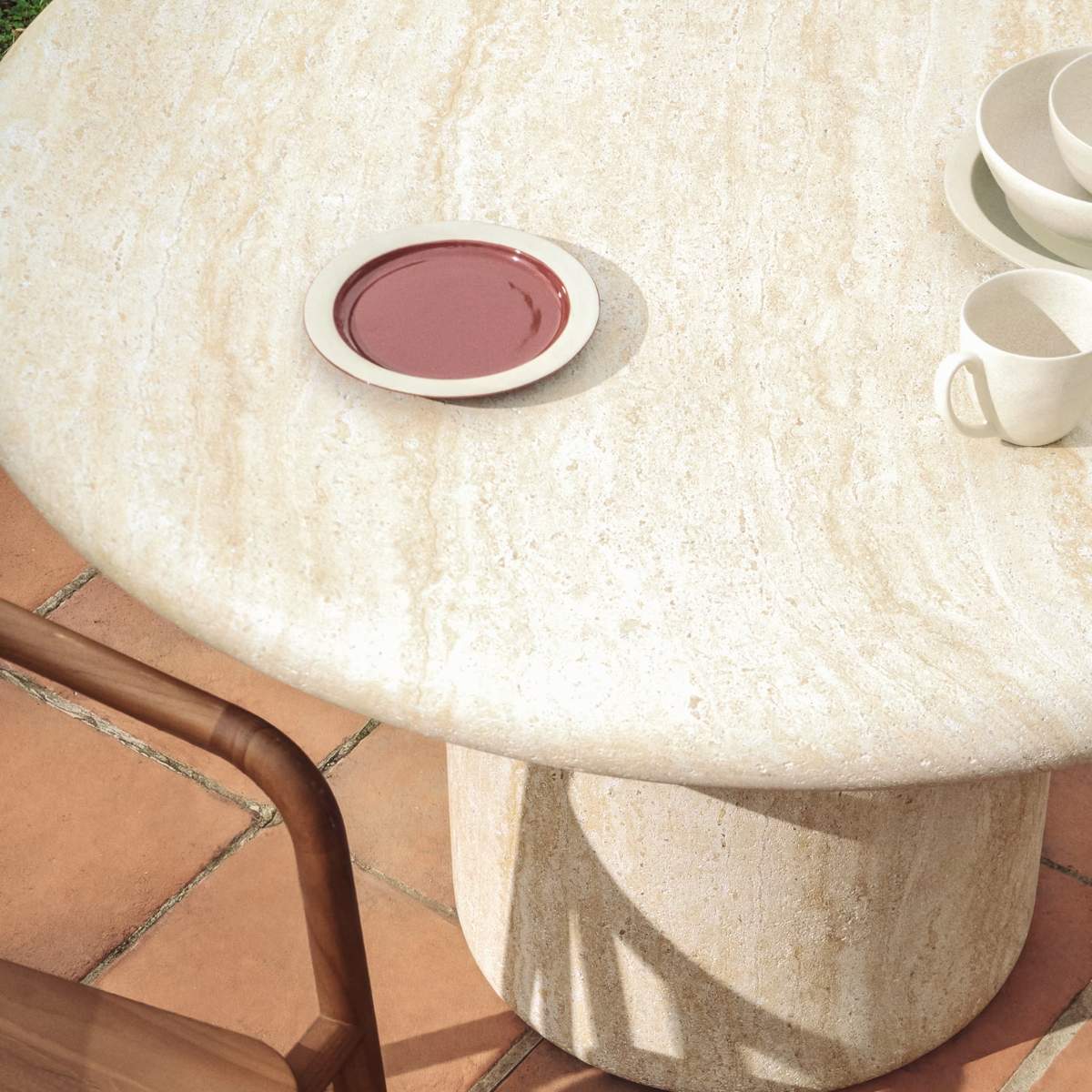 Kave Home Drasi round concrete table with travertine-effect finish Ø122cm