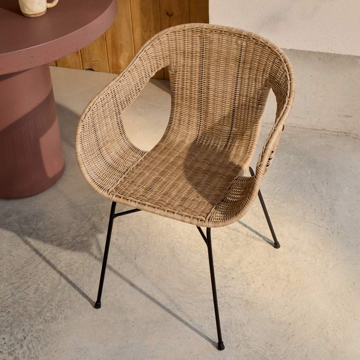 Kave Home Eltiera stackable chair in synthetic rattan with black steel frame