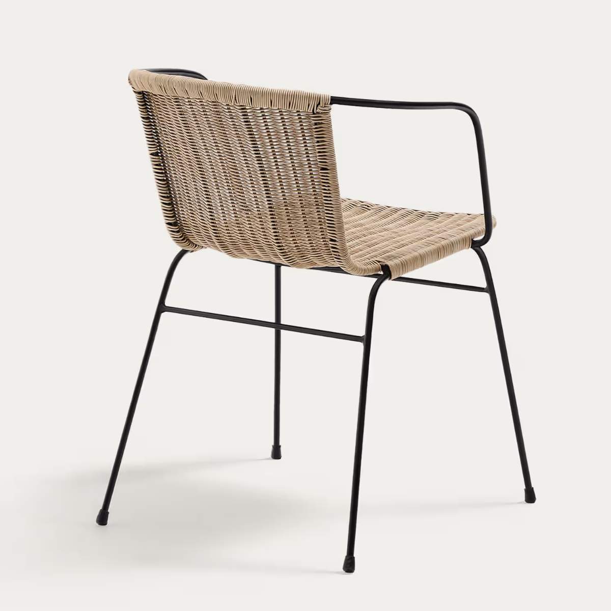 Kave Home Eltiera stackable chair in synthetic rattan with black steel frame and armrests