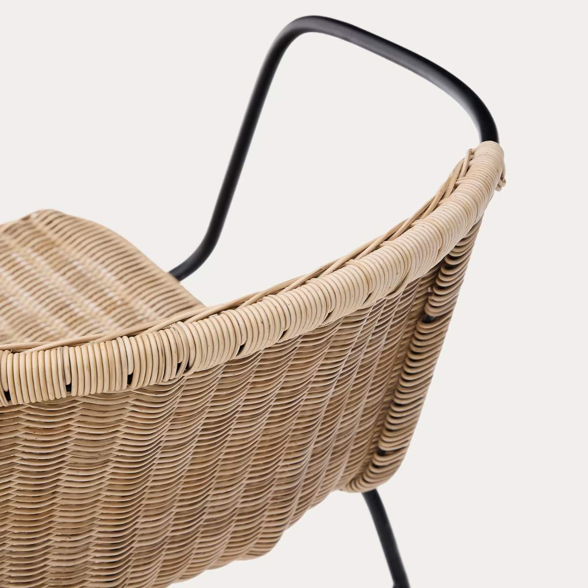 Kave Home Eltiera stackable chair in synthetic rattan with black steel frame and armrests
