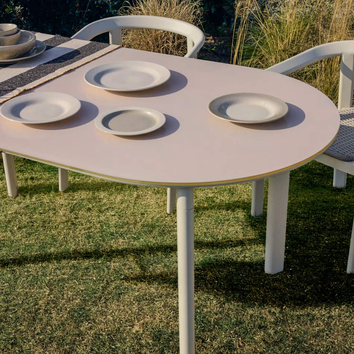 Kave Home Erice oval table in aluminium and ecru tempered glass 180 x 90 cm