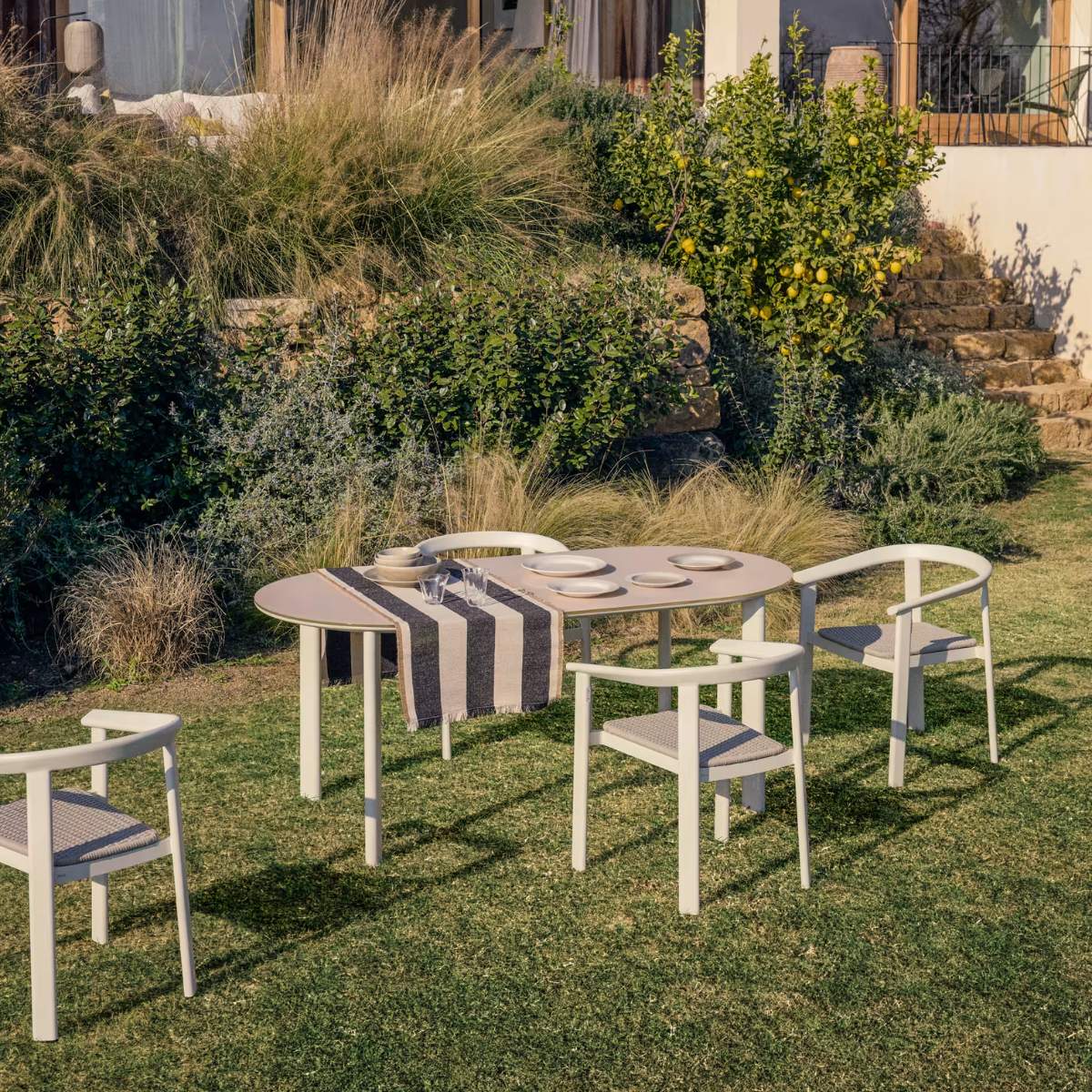 Kave Home Erice set of 6 aluminium and rope cord stackable chairs and a table in ecru aluminium and tempered glass 230 x 100cm