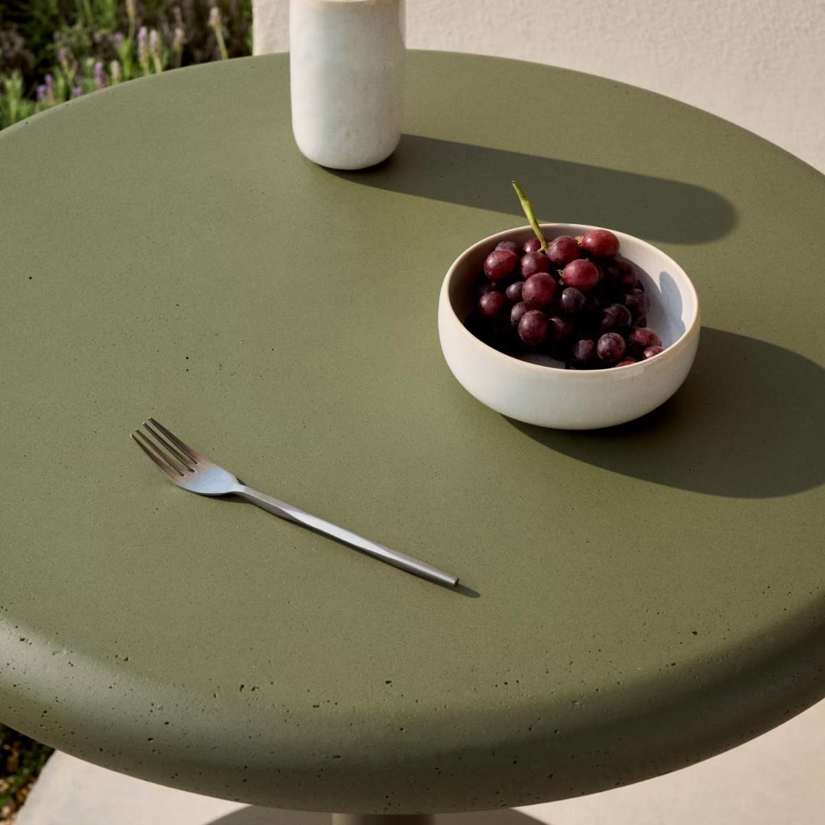 Kave Home Esilda outdoor round table with green cement top Ø70cm and green steel base Ø55x72cm