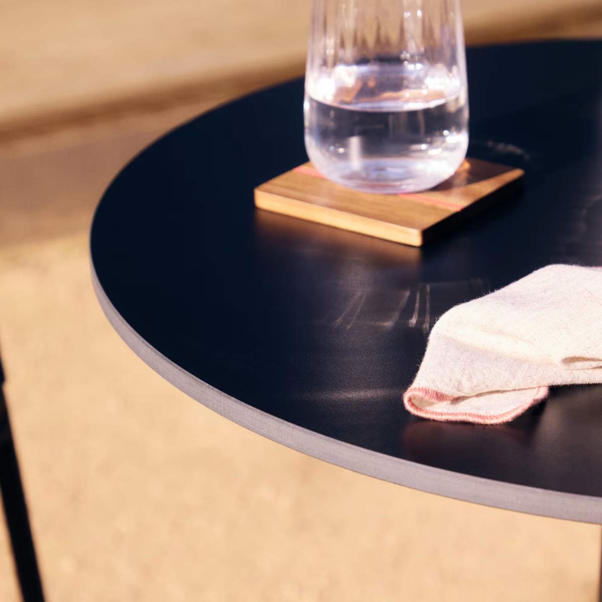 Kave Home Esilda high round outdoor table in white with metal leg in a painted black finish, Ø 60 x 96 cm