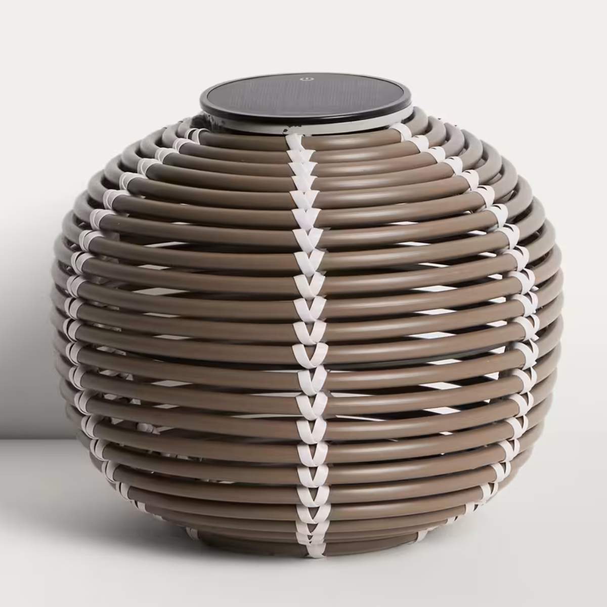 Kave Home Garoina outdoor solar LED table lamp in taupe synthetic rattan Ø25cm