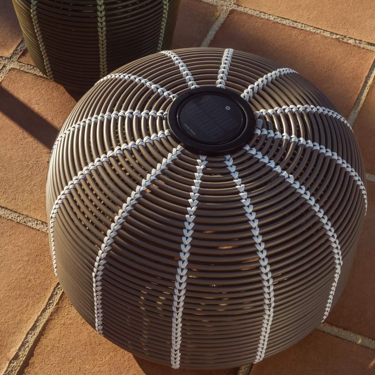 Kave Home Garoina outdoor solar LED table lamp in taupe synthetic rattan Ø50cm