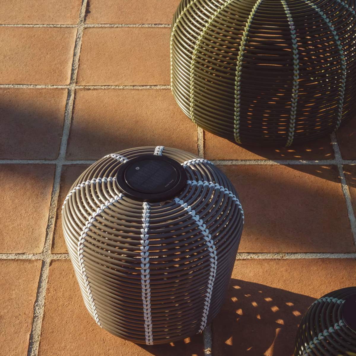 Kave Home Garoina outdoor solar LED table lamp in taupe synthetic rattan Ø35cm
