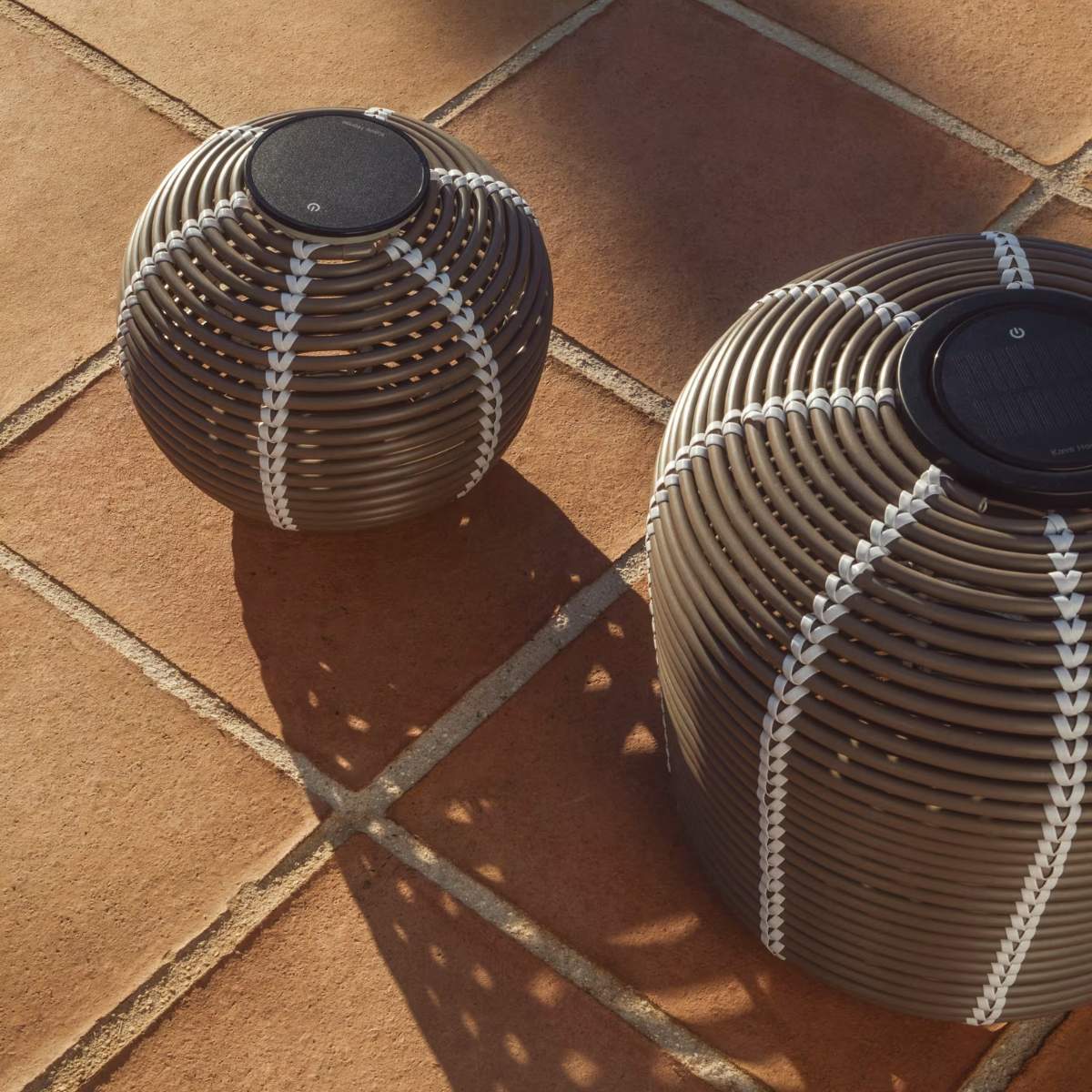 Kave Home Garoina outdoor solar LED table lamp in taupe synthetic rattan Ø25cm