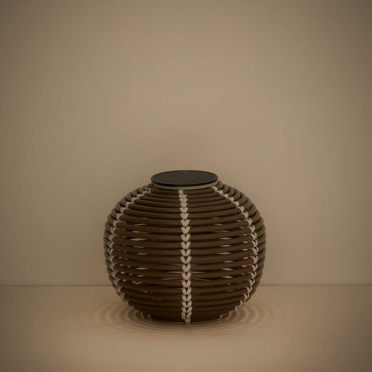 Kave Home Garoina outdoor solar LED table lamp in taupe synthetic rattan Ø25cm