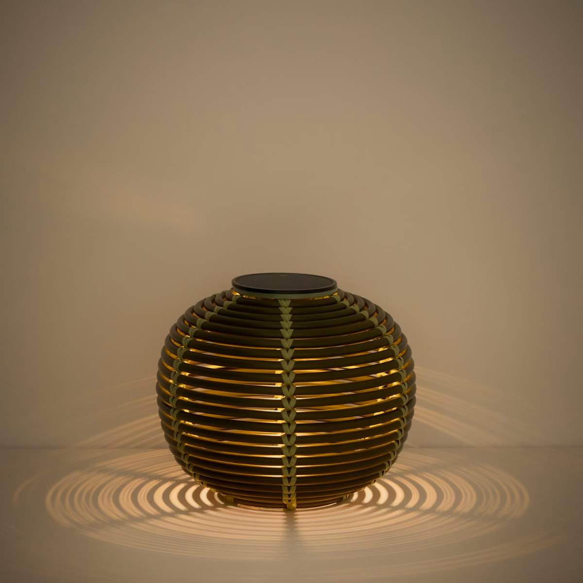 Kave Home Garoina outdoor solar LED table lamp in taupe synthetic rattan Ø25cm