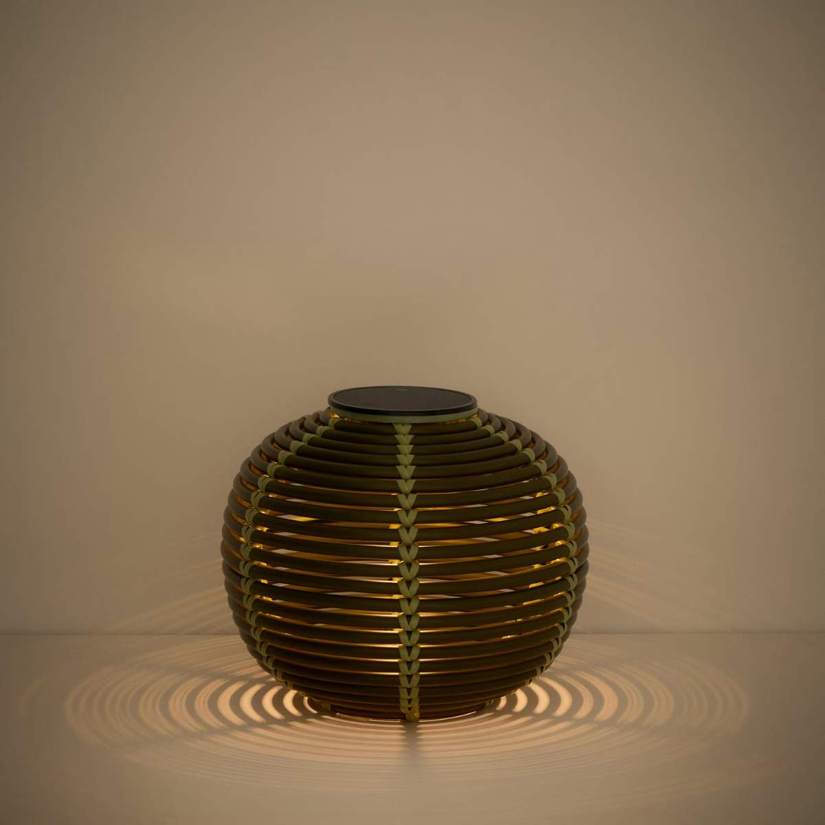 Kave Home Garoina outdoor solar LED table lamp in taupe synthetic rattan Ø25cm