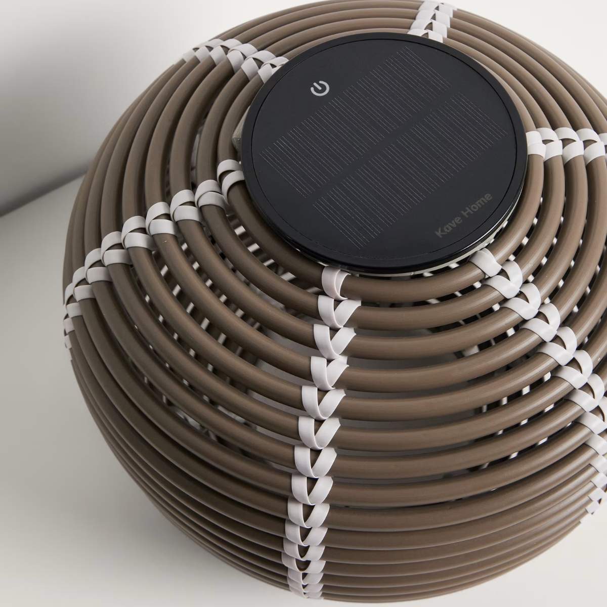 Kave Home Garoina outdoor solar LED table lamp in taupe synthetic rattan Ø25cm