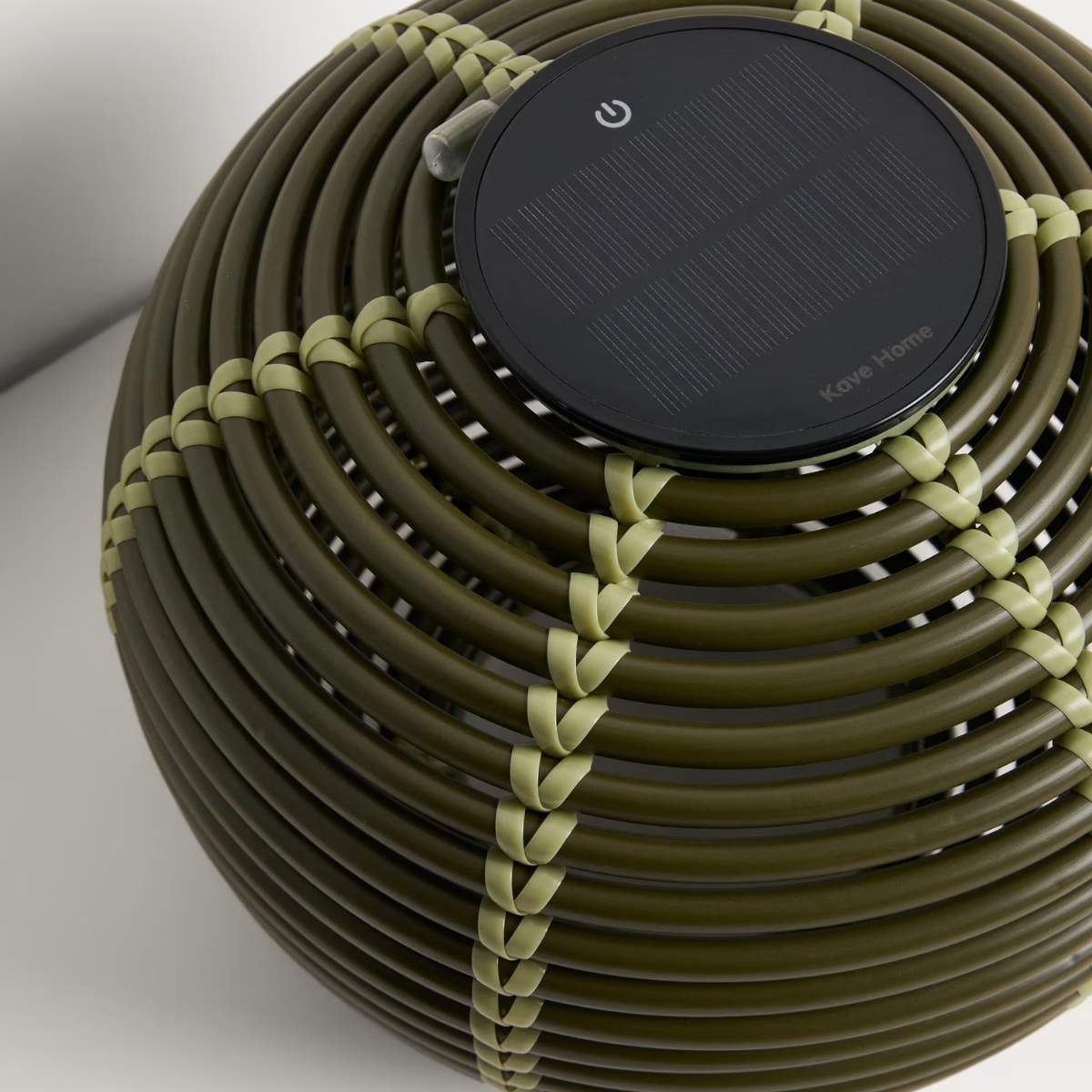Kave Home Garoina outdoor solar LED table lamp in taupe synthetic rattan Ø25cm