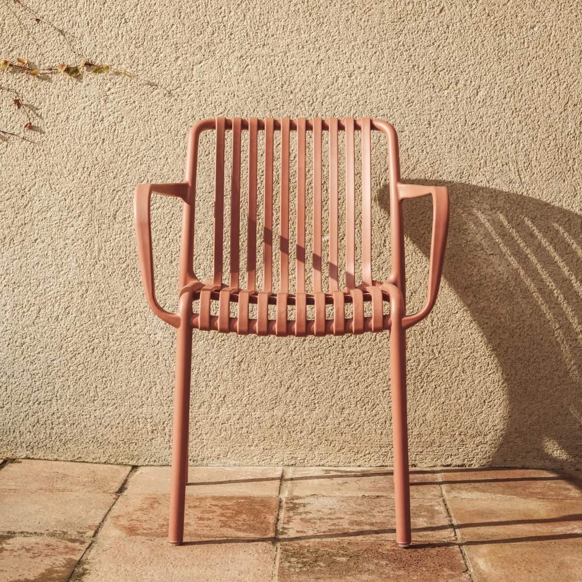 Kave Home Isabellini stackable outdoor chair in terracotta