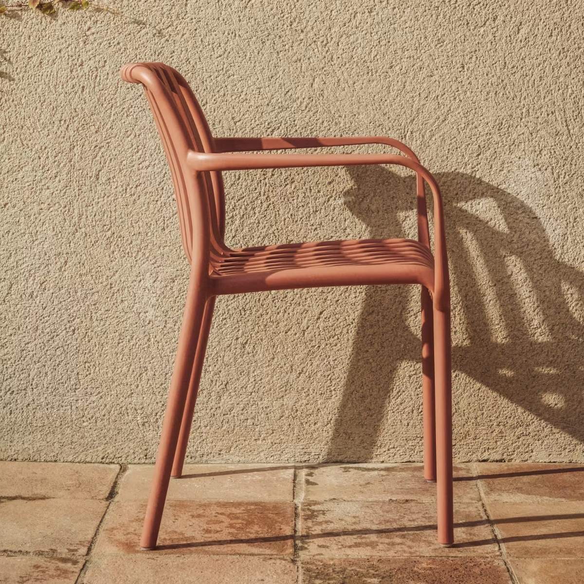 Kave Home Isabellini stackable outdoor chair in terracotta