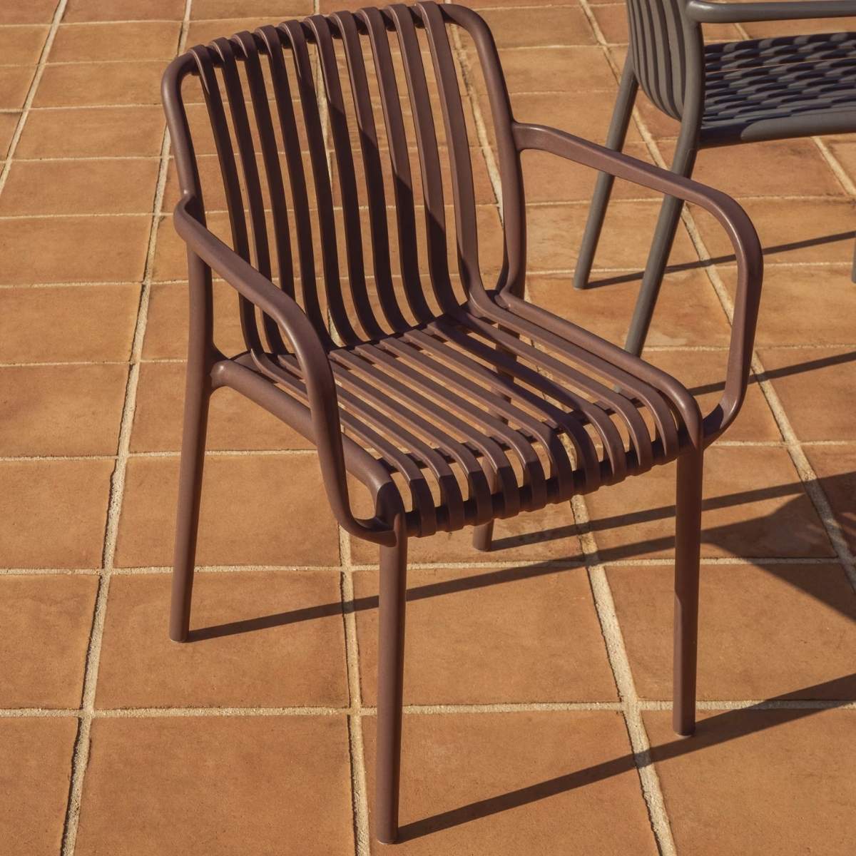 Kave Home Isabellini stackable outdoor chair in terracotta