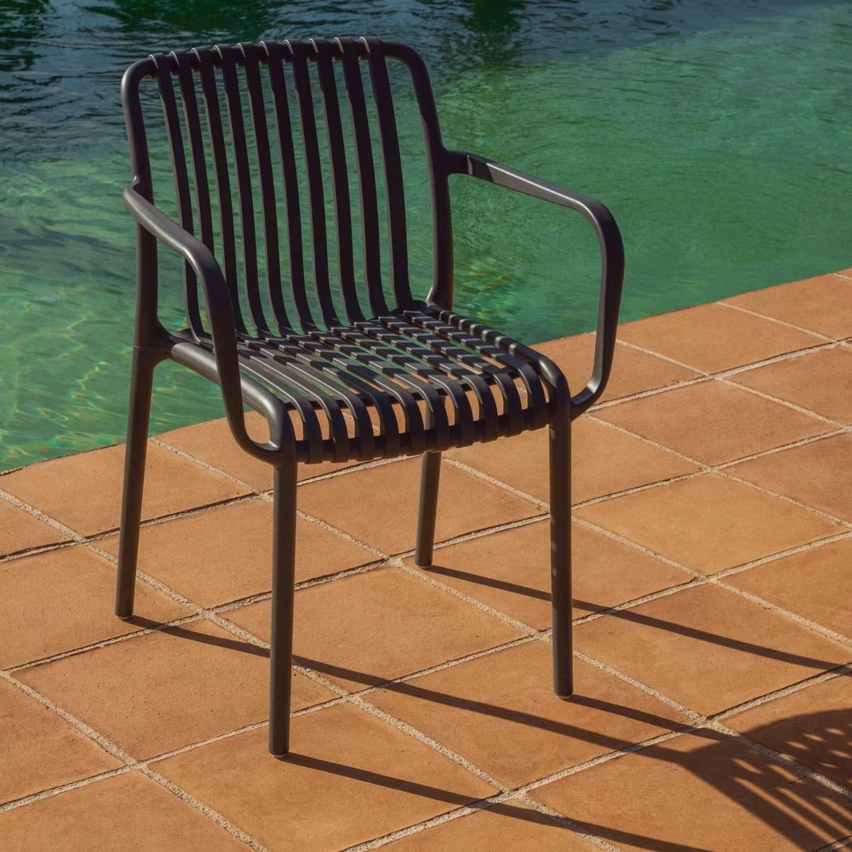 Kave Home Isabellini stackable outdoor chair in terracotta