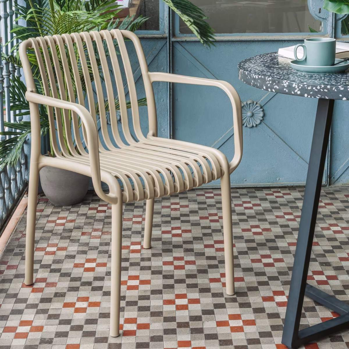 Kave Home Isabellini stackable outdoor chair in terracotta