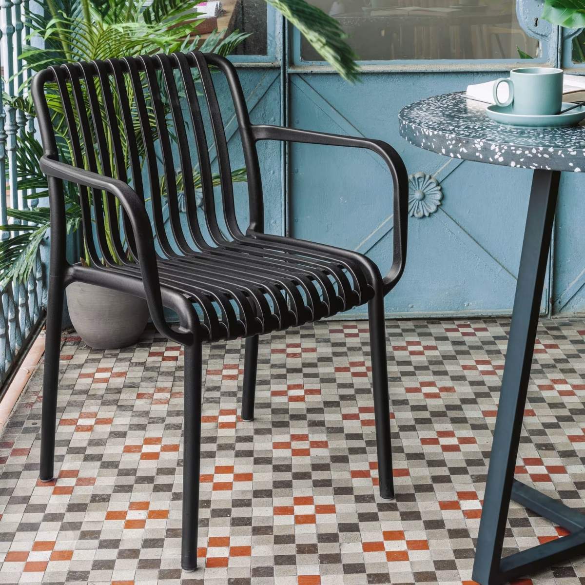 Kave Home Isabellini stackable outdoor chair in terracotta
