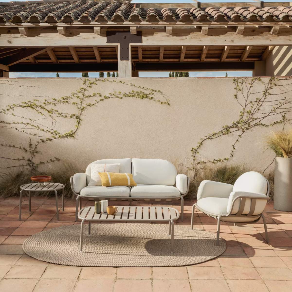 Kave Home Joncols outdoor coffee table in aluminium with taupe painted finish Ø 113 x 65cm