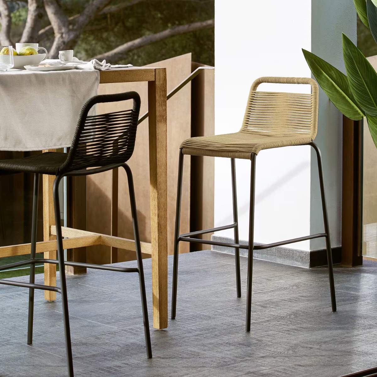 Kave Home Lambton stackable stool in brown rope and black finish steel 74 cm