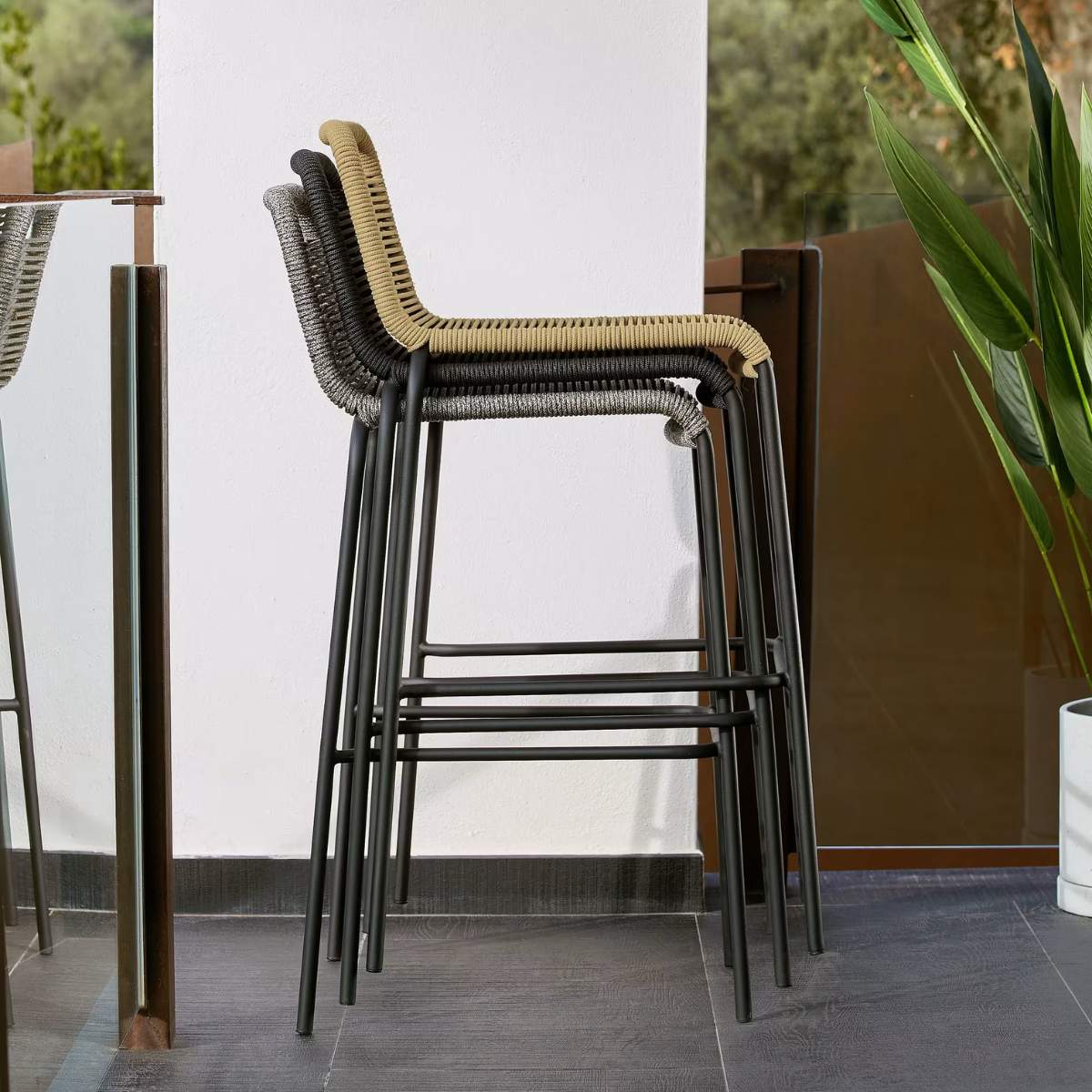 Kave Home Lambton stackable stool in brown rope and black finish steel, 62 cm