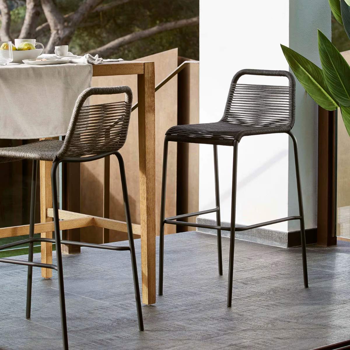Kave Home Lambton stackable stool in brown rope and black finish steel 74 cm