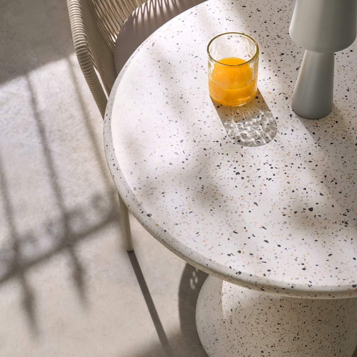 Kave Home Saura Table in white terrazzo with a white terrazzo top, 75 x Ø70.