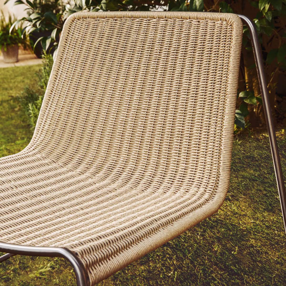 Kave Home Tavari stackable armchair in beige synthetic rope cord and AISI 304 stainless steel with brushed finish