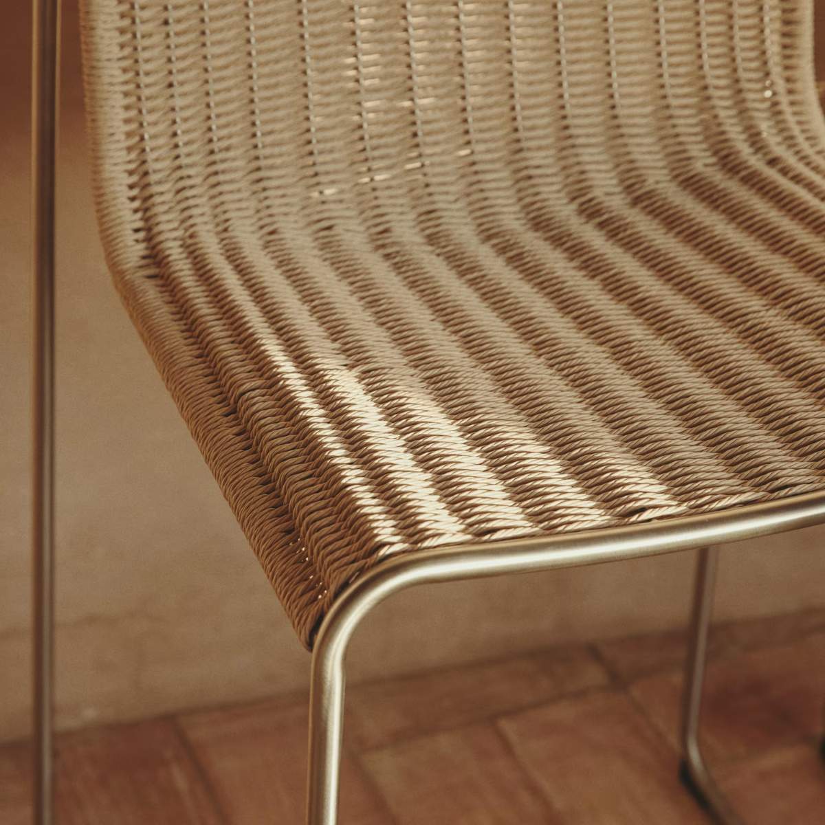 Kave Home Tavari stackable stool in beige synthetic rope cord and AISI 304 stainless steel with brushed finish 65 cm