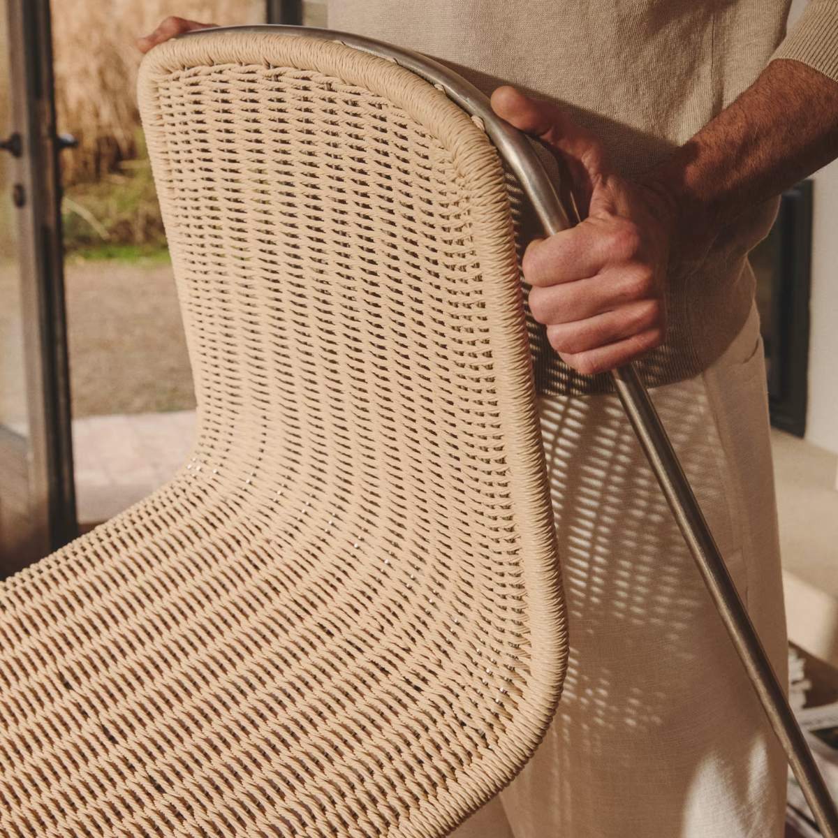 Kave Home Tavari stackable chair in beige synthetic rope cord and AISI 304 stainless steel with brushed finish