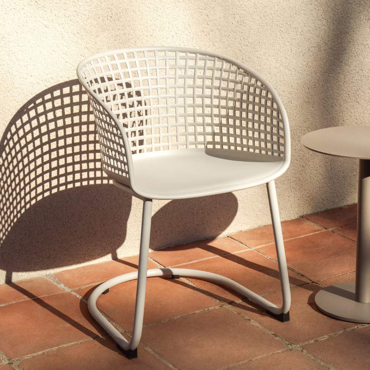 Kave Home Tenaro green plastic outdoor chair with steel structure